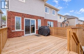 Orillia apartment for rent - A wooden deck with a black tarp on it.