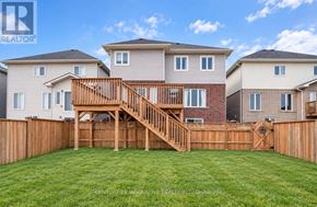 Orillia apartment for rent - A real estate company is showcasing a beautiful home with a large backyard and a deck.