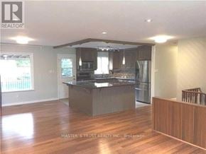 Richmond Hill (North Richvale) apartment for rent - A kitchen with a wooden floor and a counter.