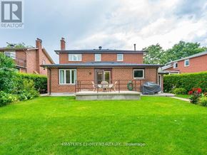 Vaughan (Glen Shields) apartment for rent - A house with a green lawn in front of it.