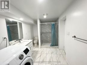 Vaughan (Glen Shields) apartment for rent - A white bathroom with a toilet, sink, and shower.