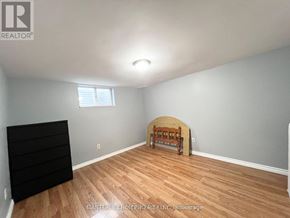 Vaughan (Glen Shields) apartment for rent - A room with wooden flooring and a window.