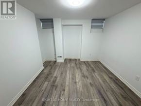 Markham (Wismer) apartment for rent - A room with wood flooring and white walls.