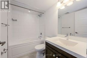 Toronto (Downsview-Roding-Cfb) townhouse for rent - A white bathroom with a toilet, sink, and shower.