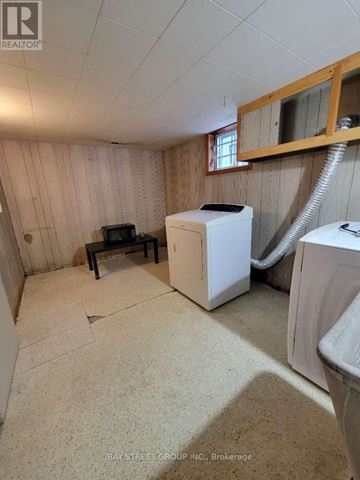 Toronto (Cliffcrest) apartment for rent - A small room with a washer and dryer in it.