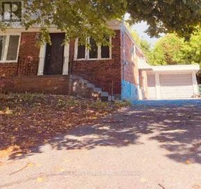 Toronto (Cliffcrest) apartment for rent - A house with a garage and a tree in front of it.