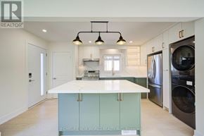 Toronto (Dorset Park) apartment for rent - A modern kitchen with a large island and stainless steel appliances.