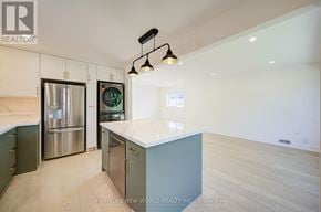 Toronto (Dorset Park) apartment for rent - A modern kitchen with a refrigerator, stove, and oven.