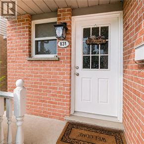 London apartment for rent - A white door with a glass window and a sign that says "welcome" on the front porch of a house.