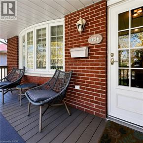 London apartment for rent - A white door is on the right of a brick wall.