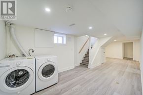 Toronto (Dorset Park) apartment for rent - A laundry room with a washer and dryer in it.