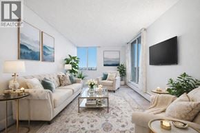 North Vancouver apartment for rent - A living room with a couch, a coffee table, and a television.