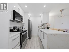 North Vancouver apartment for rent - A modern kitchen with a marble countertop and stainless steel appliances.