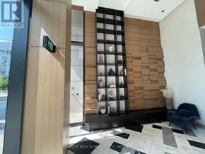 Toronto (Waterfront Communities) condo for rent - A modern interior with a wooden wall and a black and white checkered floor.