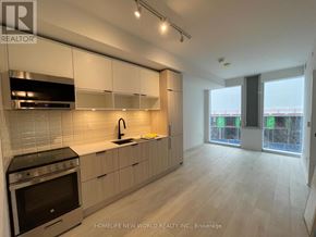 Toronto (Waterfront Communities) condo for rent - A modern kitchen with a stove top oven and a sink.