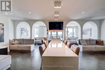 Toronto (Church-Yonge Corridor) condo for rent - A spacious living room with a long table and multiple seating options.