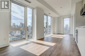 Toronto (Church-Yonge Corridor) condo for rent - A spacious living room with a view of the city skyline.