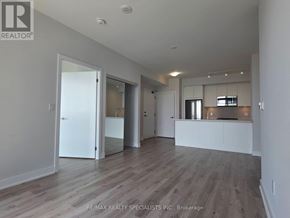 Mississauga (City Centre) condo for rent - A spacious room with wooden flooring and white walls.