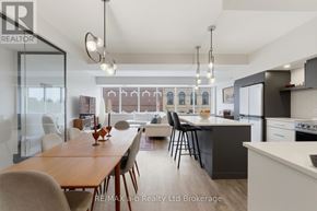 Woodstock (Woodstock - North) apartment for rent - A modern kitchen and dining area with a wooden table and chairs.