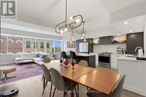 Woodstock (Woodstock - North) apartment for rent - A modern kitchen with a dining table and chairs.