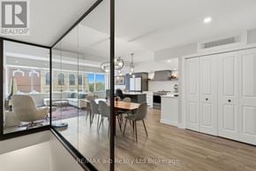 Woodstock (Woodstock - North) apartment for rent - A modern kitchen with white cabinets and a dining table with chairs.