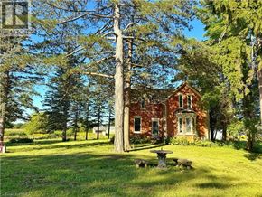 Waterford apartment for rent - A red brick house with a green lawn in front.