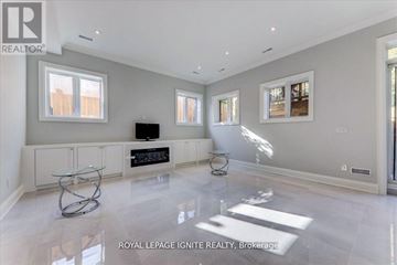 Toronto (Don Valley Village) apartment for rent - A spacious living room with a glass coffee table in the middle.