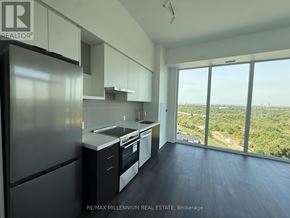 Vaughan (Steeles West Industrial) condo for rent - A kitchen with a refrigerator, sink, and stove top oven.