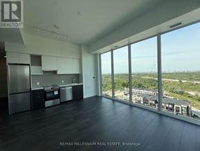 Vaughan (Steeles West Industrial) condo for rent - A spacious kitchen with a view of the cityscape.