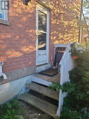 Pickering (Village East) house for rent - A brick house with a white door and a small porch.