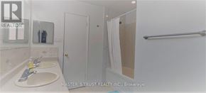 Oakville (Cp College Park) apartment for rent - A bathroom with a sink, mirror, and shower.