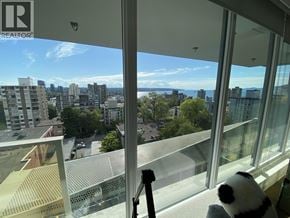 Vancouver apartment for rent - A view from a high-rise building looking out over a cityscape.