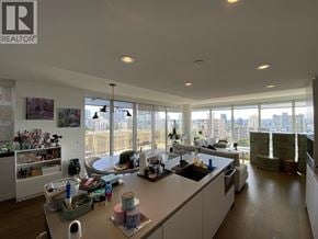 Vancouver apartment for rent - A kitchen with a large island and a view of the city.