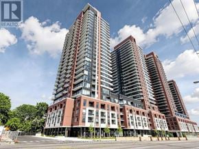 Toronto (Humber Heights) condo for rent - A modern multi-story residential building with a mix of red and white balconies.
