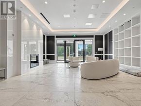 Toronto (Humber Heights) condo for rent - A reception area with a white reception desk and a white sofa.