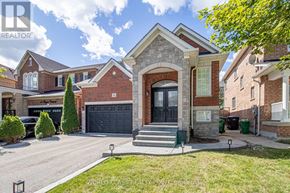 Brampton (Fletcher's Meadow) apartment for rent - A house with a brick facade and a large front yard.