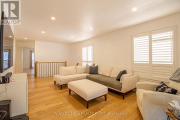 Brampton (Fletcher's Meadow) apartment for rent - A living room with white furniture and a flat screen TV.
