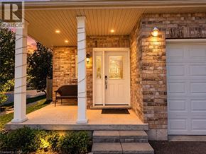 Waterloo apartment for rent - A house with a white door and a porch with a bench.