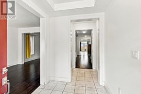 Whitby apartment for rent - A hallway with white walls and a tiled floor.