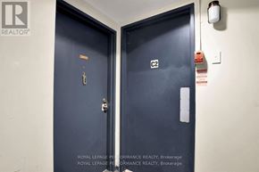 Ottawa condo for rent - Two dark blue doors with the number C2 on one of them.