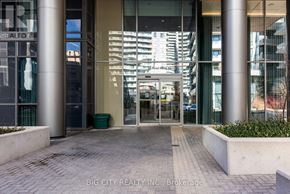 Toronto (Henry Farm) condo for rent - The entrance to a building with a glass door and a sign that reads "BIG CITY REALTY INC. Brokerage".