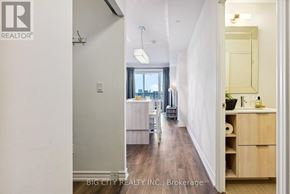 Toronto (Henry Farm) condo for rent - A hallway with a white door and a mirror on the wall.