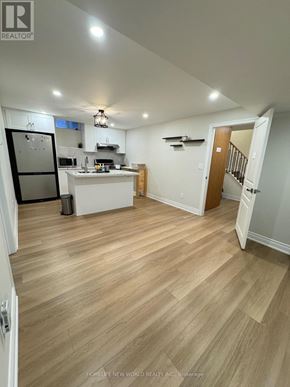 Markham (Box Grove) apartment for rent - A kitchen with a refrigerator, sink, and cabinets.