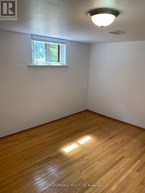 Toronto (Bendale) apartment for rent - A room with wooden flooring and a window letting in natural light.