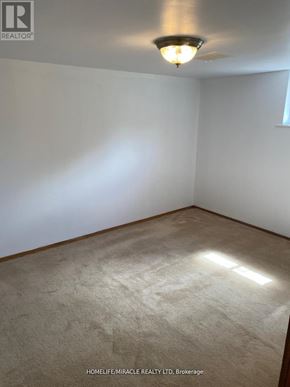 Toronto (Bendale) apartment for rent - A room with a carpeted floor and a ceiling fan.