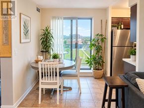 Richmond Hill (Langstaff) condo for rent - A dining room with a table set for two and a view of the outside.