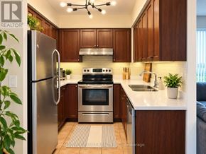 Richmond Hill (Langstaff) condo for rent - A kitchen with wooden cabinets and stainless steel appliances.