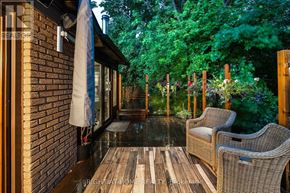 Toronto (Bendale) apartment for rent - A patio with a white umbrella and two chairs.