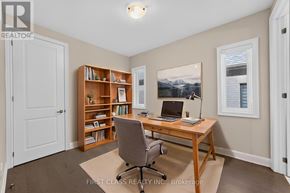 Richmond Hill apartment for rent - A room with a desk, chair, and bookshelf.