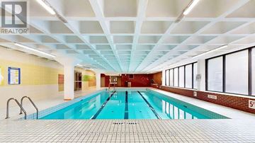 Toronto (Cabbagetown-South St. James Town) condo for rent - A large indoor swimming pool with a tiled floor and ceiling.